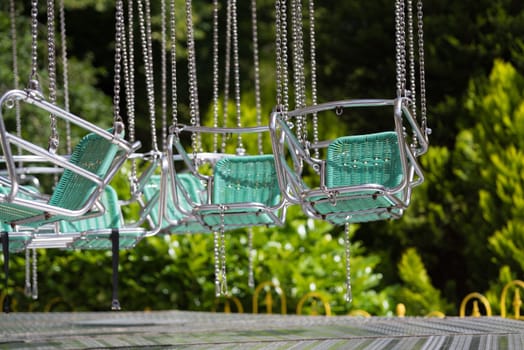 empty swing chairs in a dutch theme park