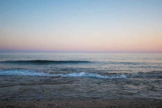 Blue sea with waves in the evening
