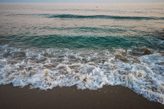 Blue sea with waves in the evening