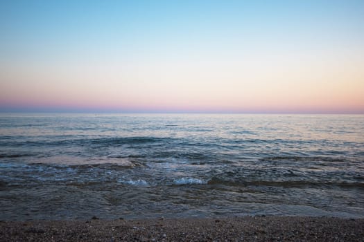 Blue sea with waves in the evening
