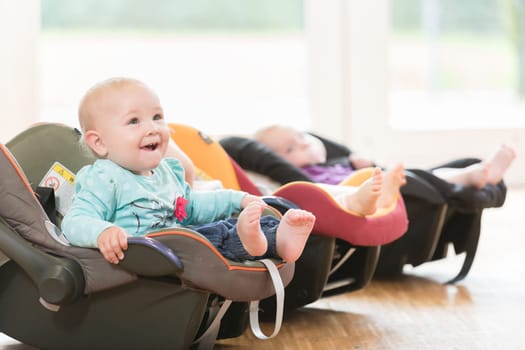New-born babies in toddler group lying in baby shells