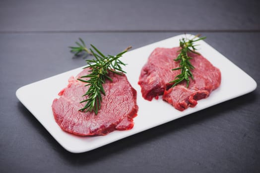Raw beef meat sliced on a plate