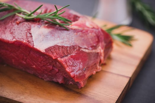 Raw beef meat on a cutting board