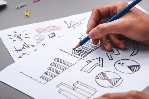 Business concept. Businessman writing idea sketch