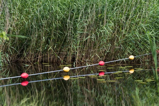 buoy line over a canal to prevent small boats to pass