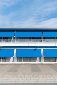 small office building with blue sun shades