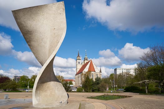 Flag monument and St. John's Church on the banks of the Elbe in Magdeburg.