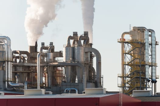 Chemical plant. Silos and smokestacks of a factory.