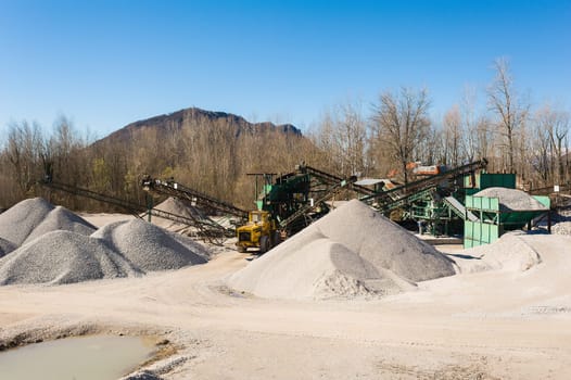 Extraction gravel. Machinery distribution and classification by size gravel. Conveyors for transporting gravel.Gravel quarry. Construction industry.