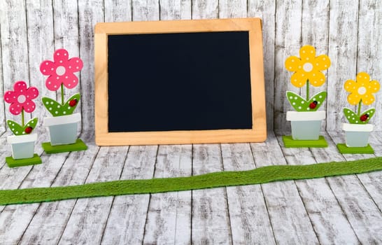 Decorative wooden flowers with empty panel