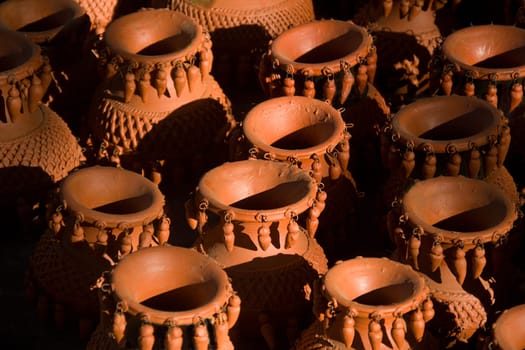 Closer view of heap of artfully crafted red earthen wares