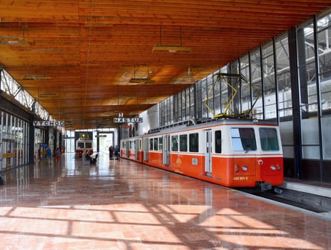 STRBA, SLOVAKIA - SEPTEMBER 14, 2016: Interior of the Strba railway station with train moving on cog railway which is 4753 metres long between Strba and Strbske pleso station. This railway was rebuild in 1970 due to world ski championship in Strbske Pleso.