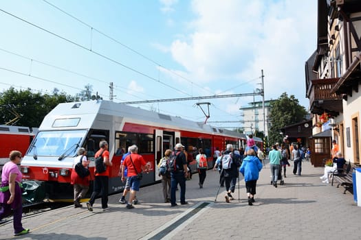 STARY SMOKOVEC, SLOVAKIA - SEPTEMBER 14, 2016: Rush hour at railway station Stary Smokovec in High Tatras. People travelling to Stary Smokovec to begin hiking in High Tatras.