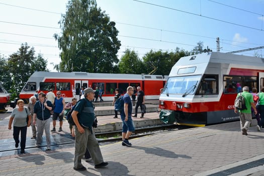 STARY SMOKOVEC, SLOVAKIA - SEPTEMBER 14, 2016: Rush hour at railway station Stary Smokovec in High Tatras. People travelling to Stary Smokovec to begin hiking in High Tatras.
