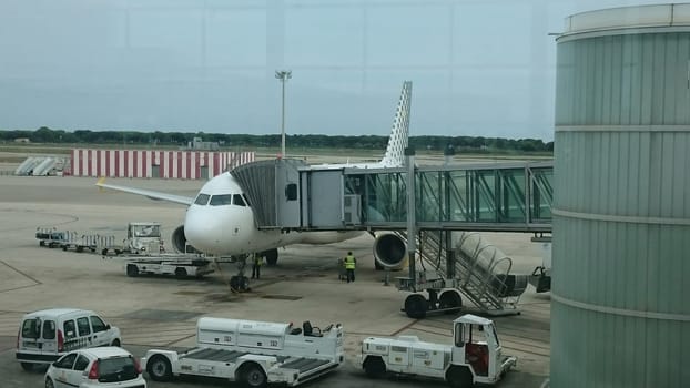 BARCELONA, SPAIN - SEPTEMBER 07, 2015: Passenger jet plane Airbus A310 of spanish low cost airlines Vueling at apron and waiting for a boarding of passengers at El Prat international airport.