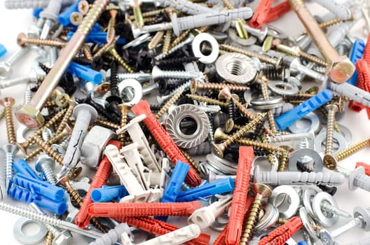 Nuts bolts and screws isolated over white background
