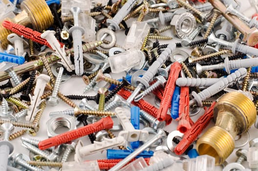 Nuts bolts and screws isolated over white background