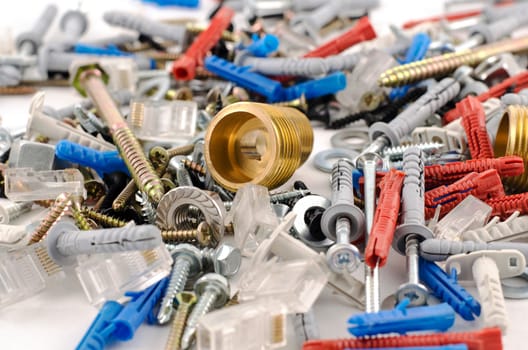 Nuts bolts and screws isolated over white background