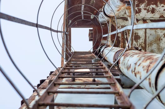 Rusty ladder on an abandoned building site