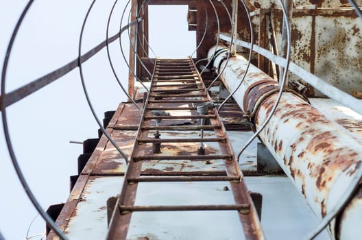 Rusty ladder on an abandoned building site