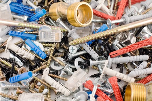 Nuts bolts and screws isolated over white background