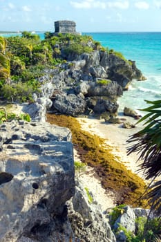 Small beach and mayan ruins at Tulum, Mexico in the Riviera Maya