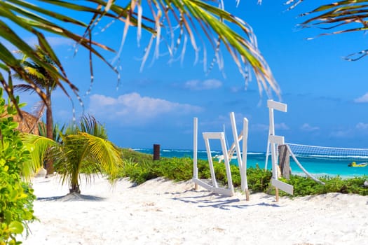 Beautiful white sand and palm trees in Tulum, Mexico