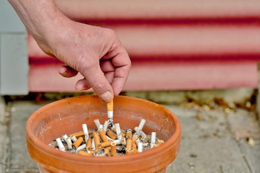 Cigarette is expressed in an ashtray
