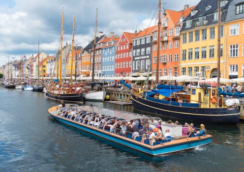 COPENHAGEN, DENMARK - JULY 31, 2016: Summer view of the famous Nyhavn with its colorful buildings