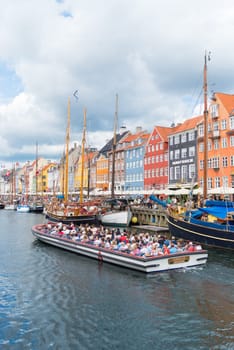 COPENHAGEN, DENMARK - JULY 31, 2016: Summer view of the famous Nyhavn with its colorful buildings