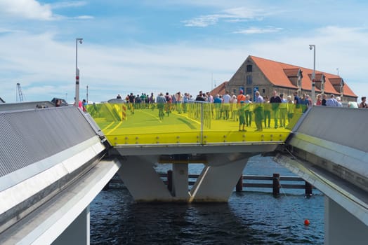 COPENHAGEN, DENMARK - JULY 31, 2016: Inderhavnsbroen, a combined pedestrian and bicyclist bridge across the Copenhagen inner harbour. It measures 180 metres (590 ft).