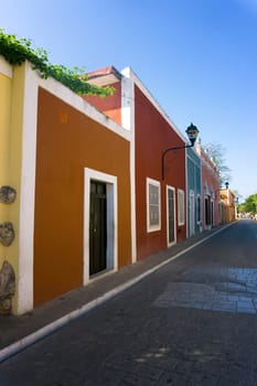 Vertical view of a colorful colonial street in Valladolid, Mexico