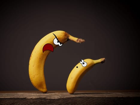 Big angry banana boss with small employee, Business or career concept