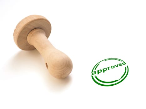 Stamp approved on a white table with green text