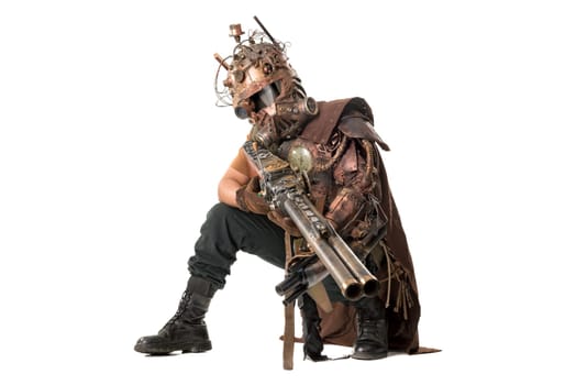 Futuristic soldier posing with gun and armor isolated in white