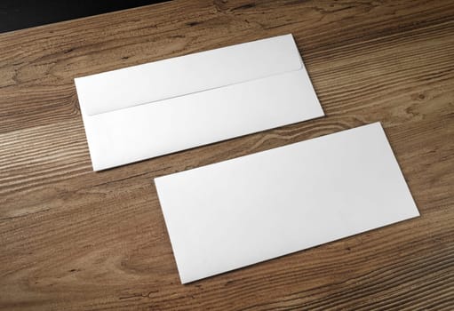 Blank envelopes on white with soft shadows. Front and back side.
