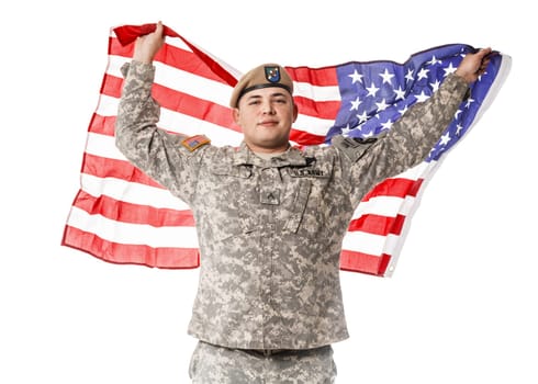 Army Ranger from Special Troops Battalion in universal Camouflage pattern Uniforms and Tan beret with Ranger Regiment crest standing and holding waving US flag in his hands proudly. National holidays: Veterans Day, Memorial Day
