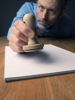 Businessman background with a wooden stamp, wide angle shot