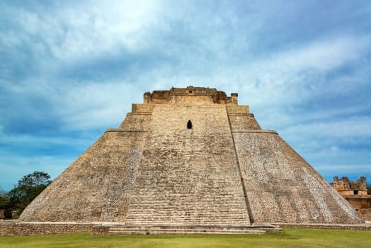 View of the pyramid known as the House of the Magician in the Mayan ruins of Uxmal in Mexico