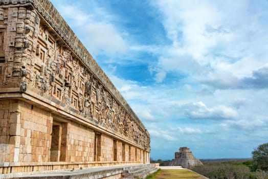 View of the governors palace and the house of the magician in the Mayan ruins of Uxmal, Mexico