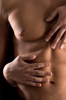 Ma's torso with woman's hands around isolated in black