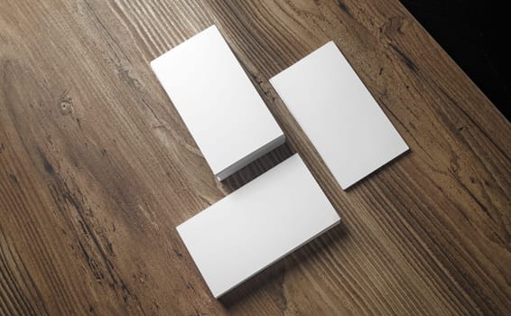 Stacks of blank business cards on wood background. Template for your design. Blank name cards. Top view.