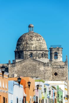 Ex Temple of San Jose rising above colorful colonial buildings in Campeche, Mexico