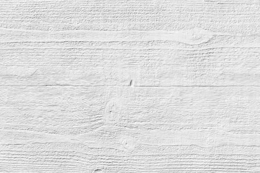 White textured molded gypsum panel on wood