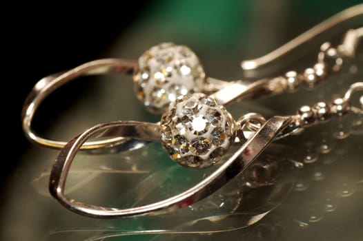 Close-up photo about the shiny silver earrings.
