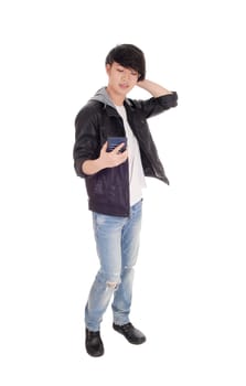 An Asian man looking at his cell phone and is wondering what.he is seeing at his phone, isolated for white background..