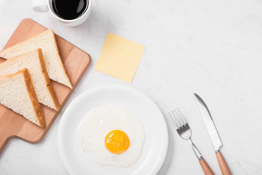 Traditional breakfast with fried eggs on a plate