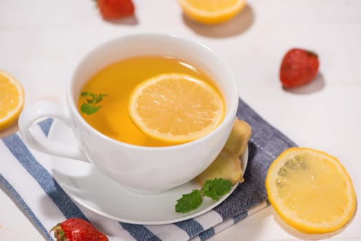 Healthy ginger tea ingredients on a wooden table