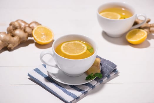 Healthy ginger tea ingredients on a wooden table