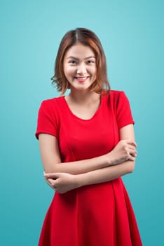 Shopping woman smiling joyful isolated on blue.